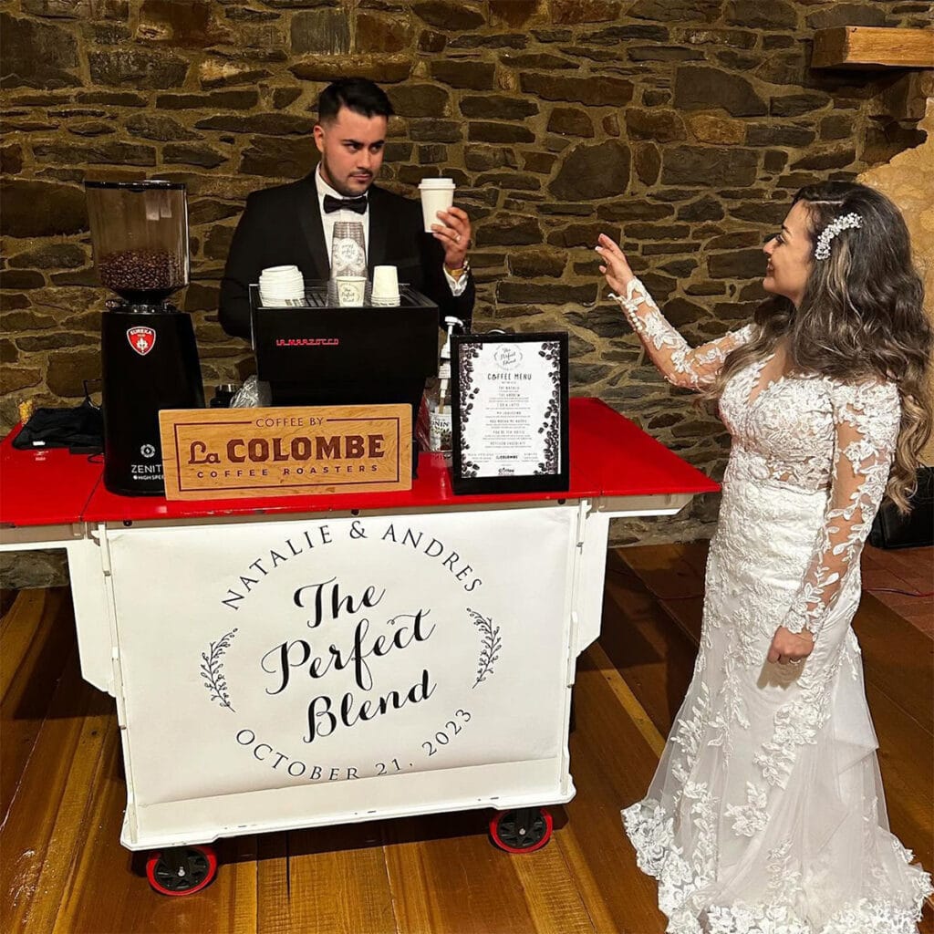 Wedding couple at the personalized Natalie and Andres Coffee Malem coffee cart.
