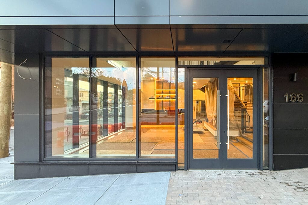 Building entrance at 166 Van Reipen Avenue, home to Coffee Malem’s Jersey City shop.